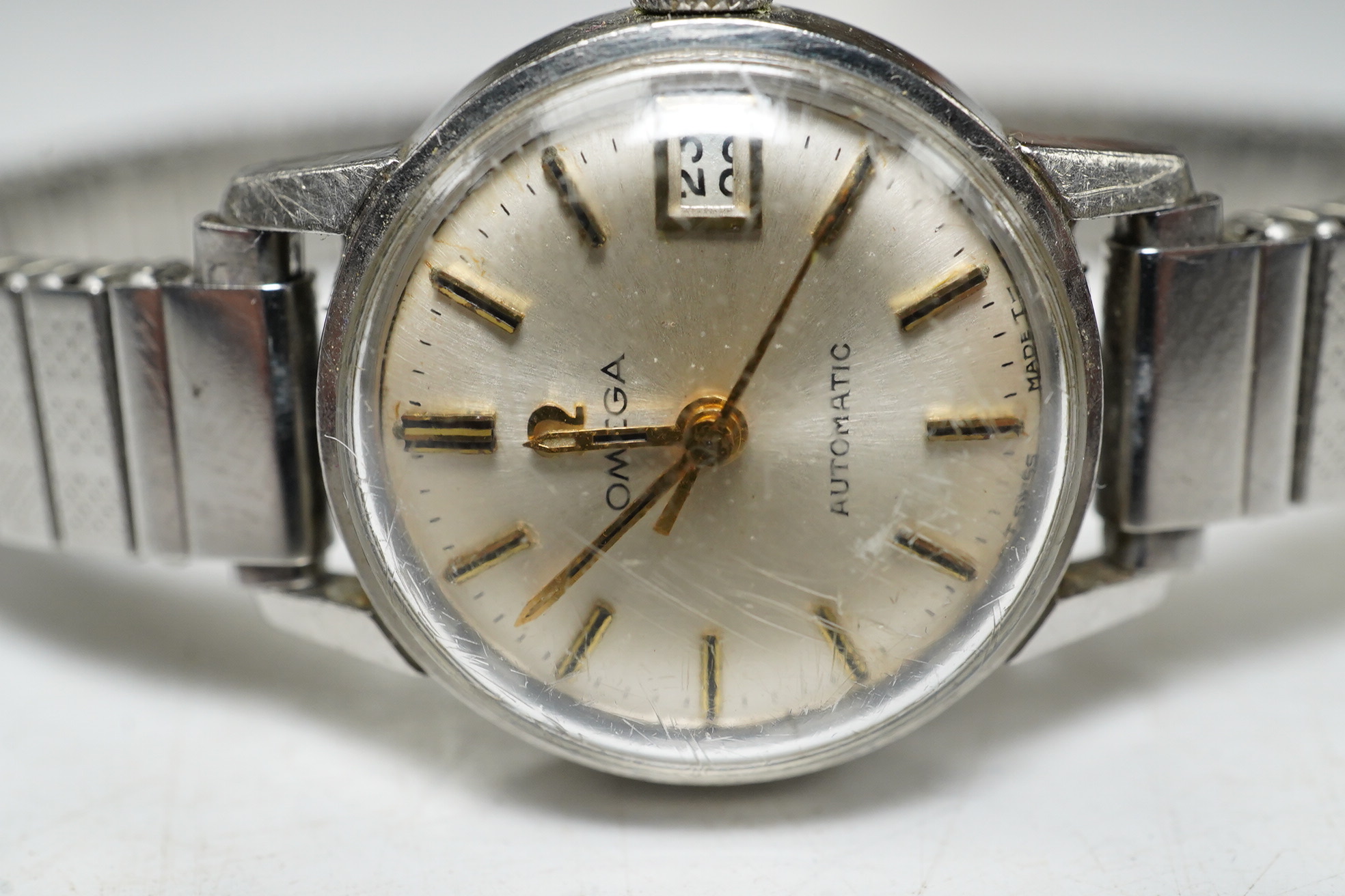 A ladies steel Omega Seamaster Automatic wrist watch, with centre seconds and date aperture. Condition - fair, movement going